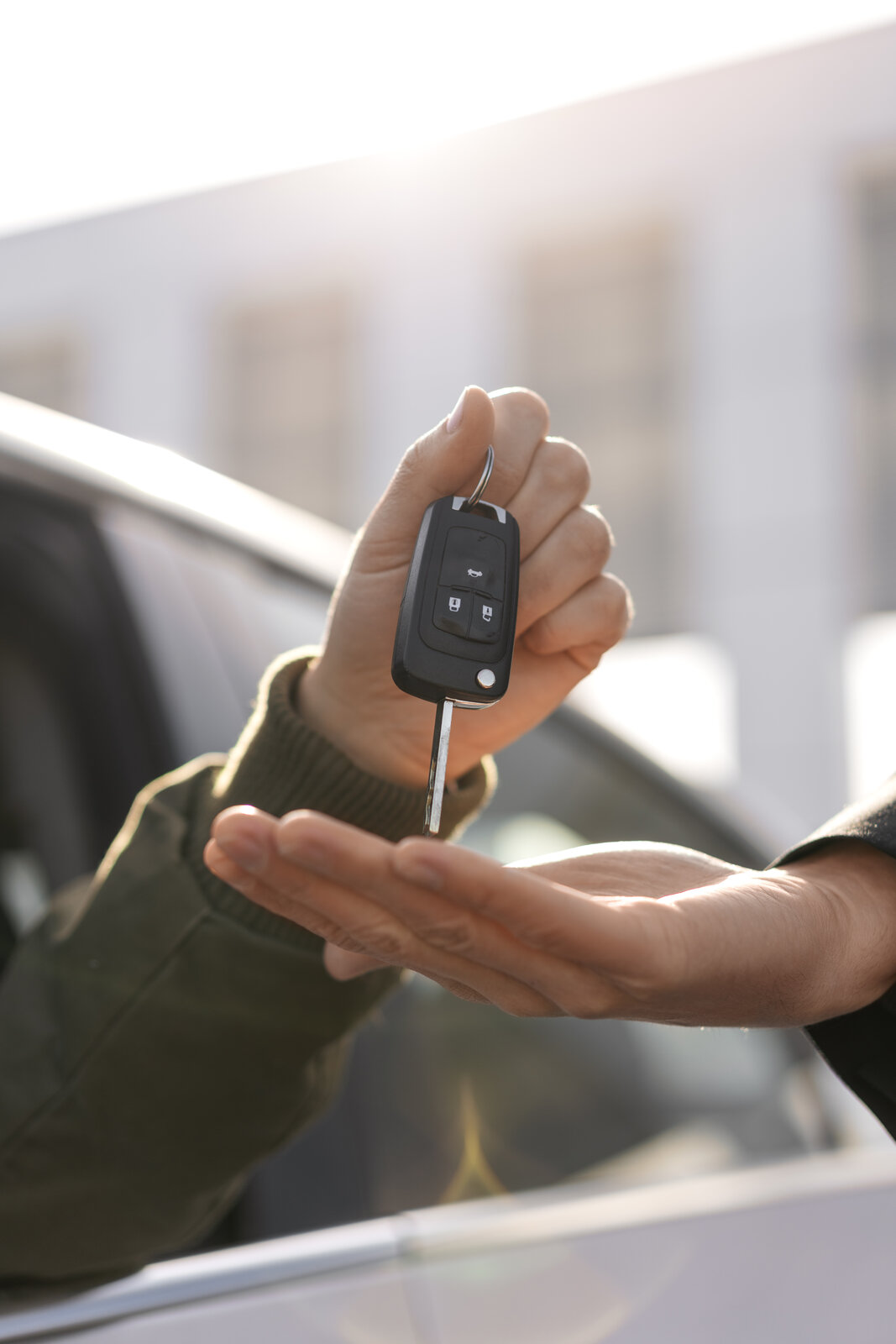 side-view-hands-holding-car-key side-view-hands-holding-car-key